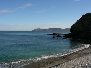 Photo des criques et plages rocheuses au port de...